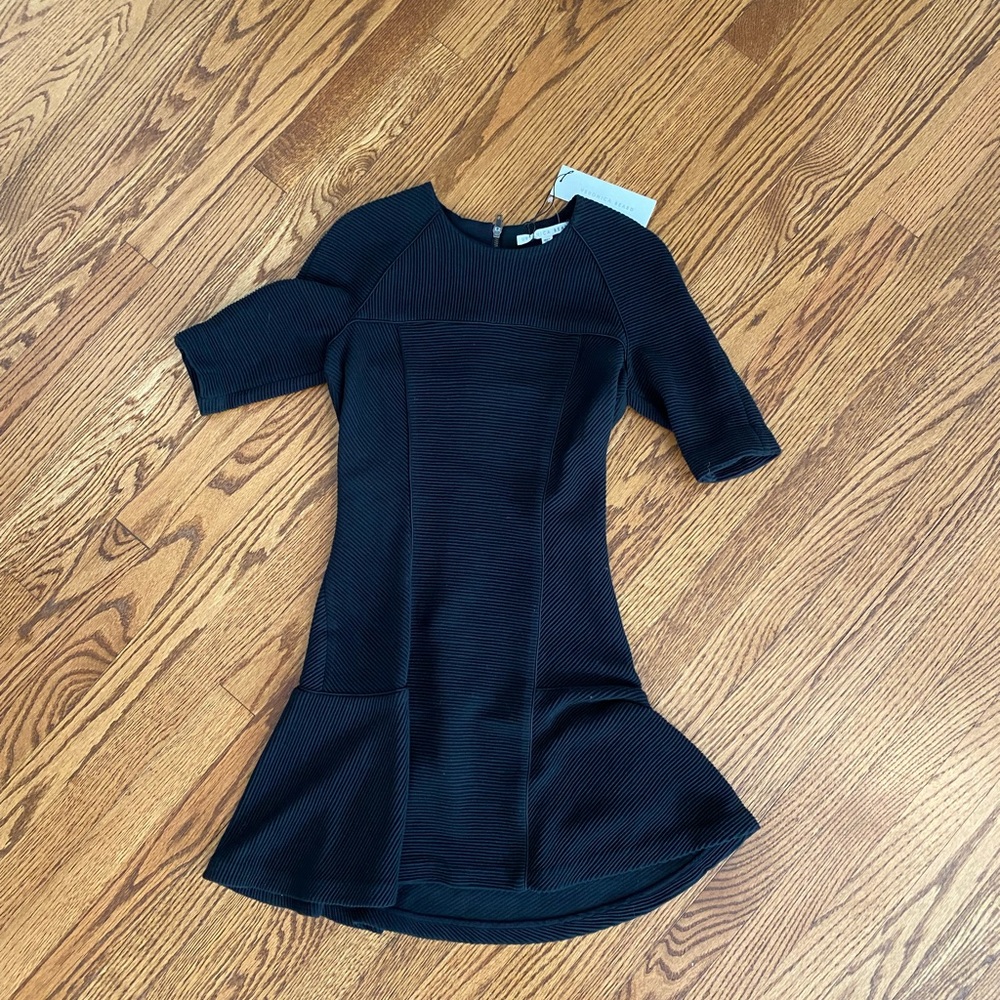 Veronica Beard NWOT black ribbed flounce dress.
